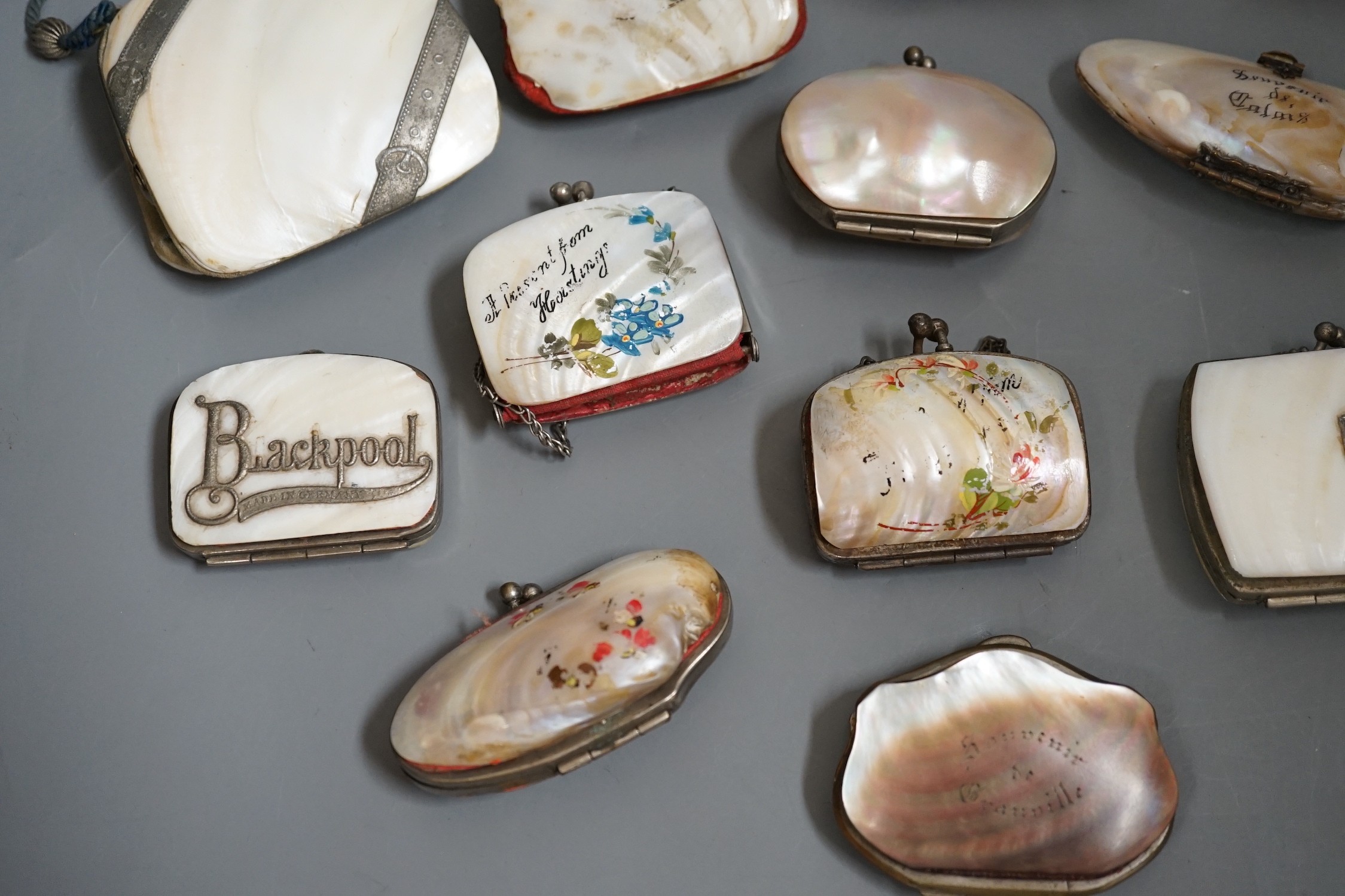 Nine 19th century souvenir mother of pearl purses, and three others